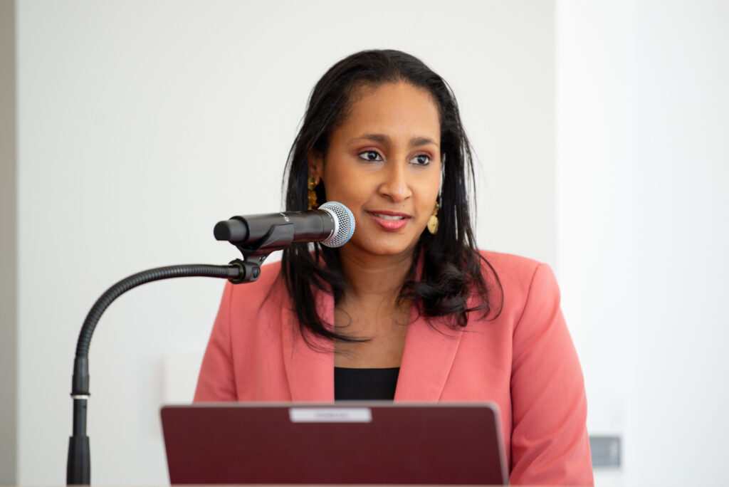 Angélica María Mayolo Obregón speaks into a microphone.